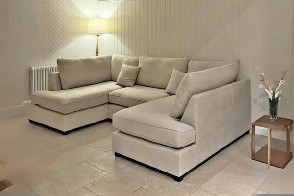 Beige coloured u shaped small sofa